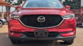 2018 Mazda CX-5 in wine red exterior with tan brown leather interior at Axis Motors Limited.