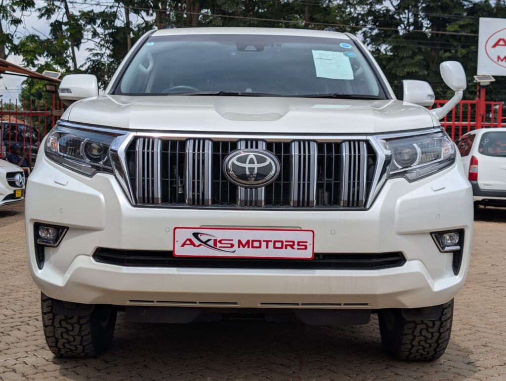 2020 Toyota Land Cruiser Prado TX pearl white 4x4 with black leather interior.